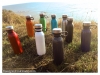 colors-bottles-with-loop-carry-by-the-beach