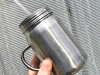 Stee-Mason-Jar-With-Handle-In-Hand