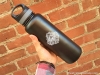 40-oz-insulated-bottle-black-skull-logo-handheld